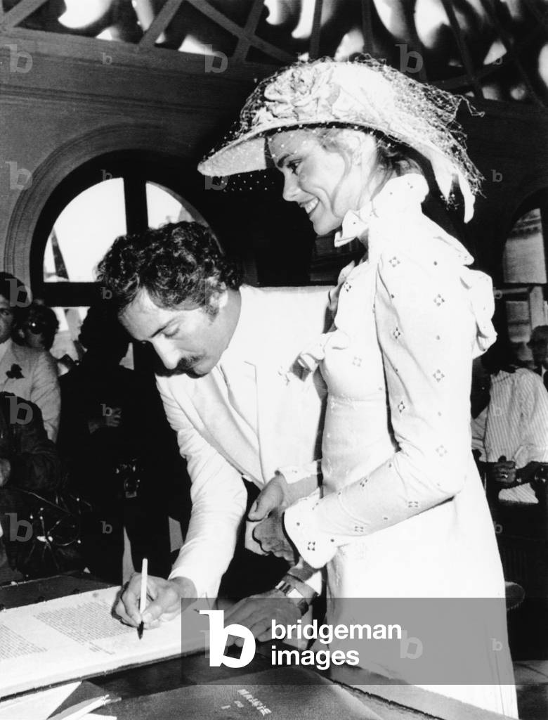 Newly wed Errol Whitson, signs the marriage registry after marrying model Margot Hemingway. They were married at the municipal building of the First Arrondissement in Paris. They divorced in 1978