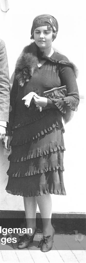 Barbara Hutton, Woolworth heiress, wearing a dress with diagonal ruffles, on an ocean liner. c. 1930