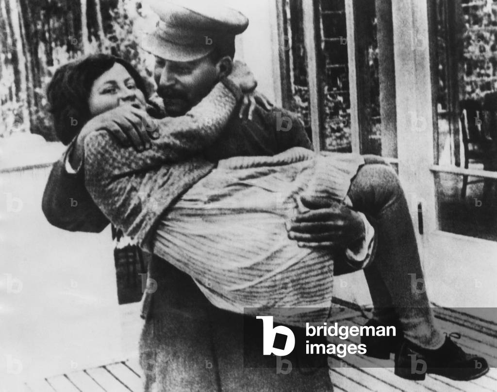 Soviet General Secretary Josef Stalin (right), holding his daughter Svetlana, Moscow, 1937.