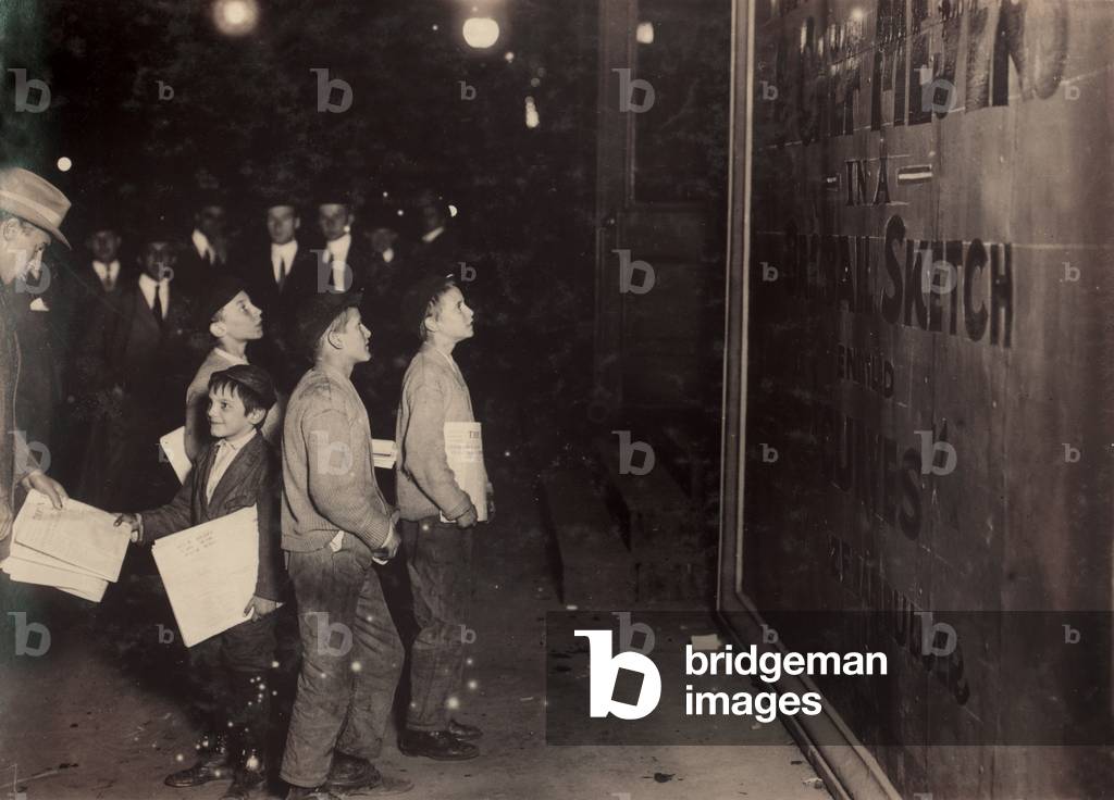 New York City, newsies hanging around Long Acre Square (Times Square) waiting for the Victoria Theatre to close, Broadway and 42nd Street, New York, photograph by Paul B. Schumm, October, 1910