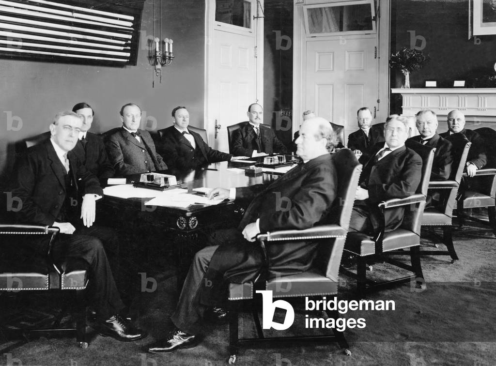 Woodrow Wilson (1856-1924) and his first Cabinet in 1913. To his immediate left is William McAdoo, Sec. of Treasury, and to his right, Williams Jennings Bryan, Sec. of State