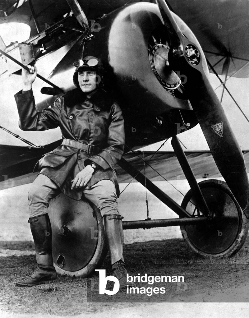 Lt. Earl Carroll, prominent composer, was a full-fledged World War I aviator. He sits beside his fast scout machine. c. 1918
