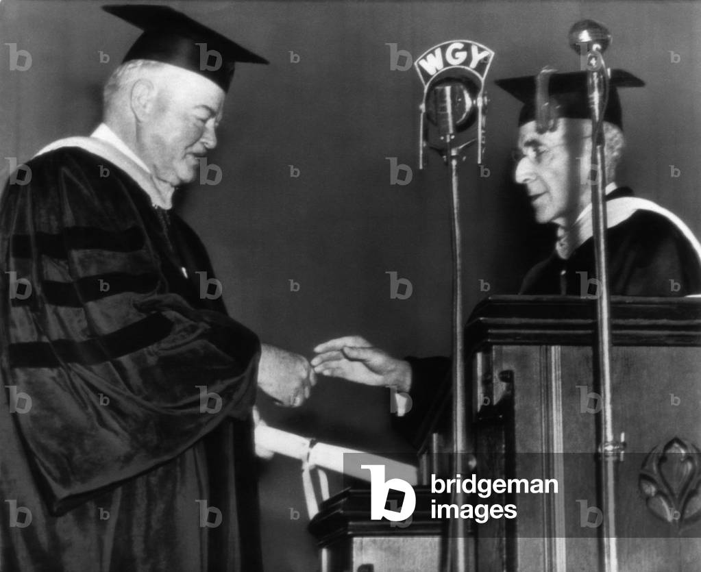 Former President Herbert Hoover, receives an honorary degree of Doctor of Engineering from Dr. John A. Ross Jr., President of Clarkson College of Technology, New York, October 8, 1945