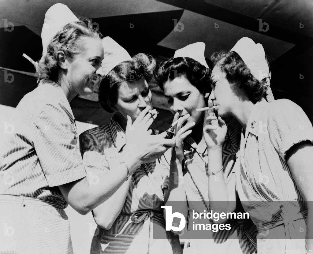 Army nurses lighting up their cigarettes in 1947, when smoking was seen as a simple pleasure rather than a health hazard