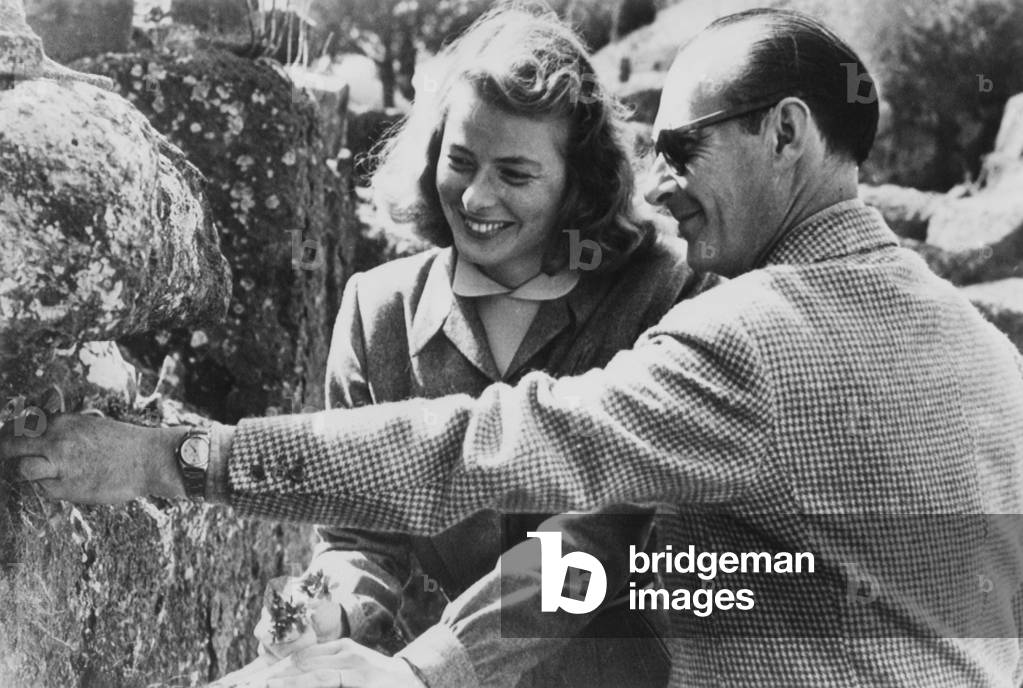 Ingrid Bergman and Roberto Rossellini became lovers during the filming of STROMBOLI, April 1949. Bergman is holding the flowers he collects, in the first months of their romance. At the time, she was married to Petter Lindstrom, and he to Assia Noris Marcella De Marchis