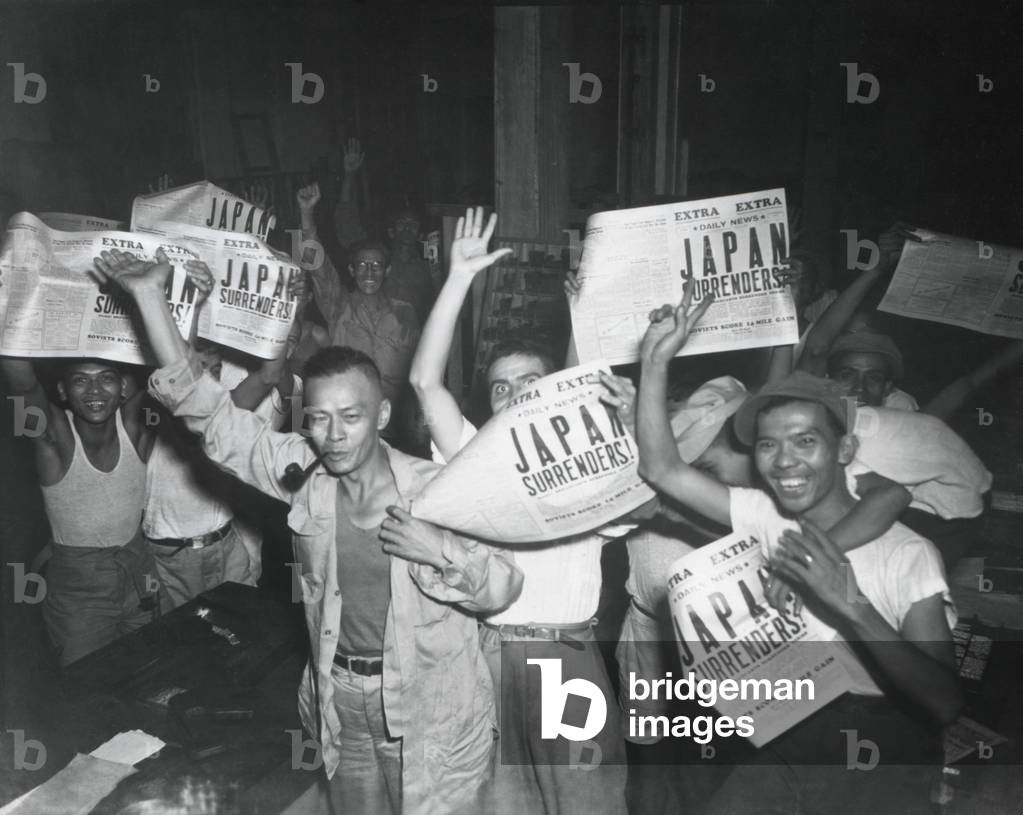 Filipinos celebrate headlines, 'Japan Surrenders' at the end of World War 2. August 10-15, 1945