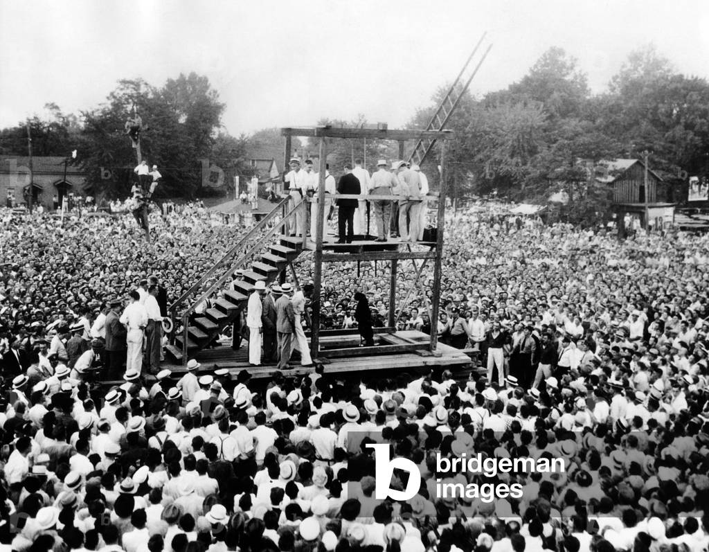 Thousands witness the public hanging of African American, Rainey Bertha, age 22. It was the last public hanging in the United States. Owensboro, Kentucky. Aug. 14, 1936