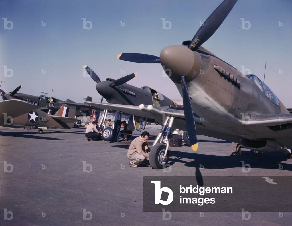 World War II, P-51 mustang fighter planes being prepared for test flight at the field of the North American Aviation Inc. Plant, photograph by Alfred T. Palmer, Inglewood, California, October, 1942