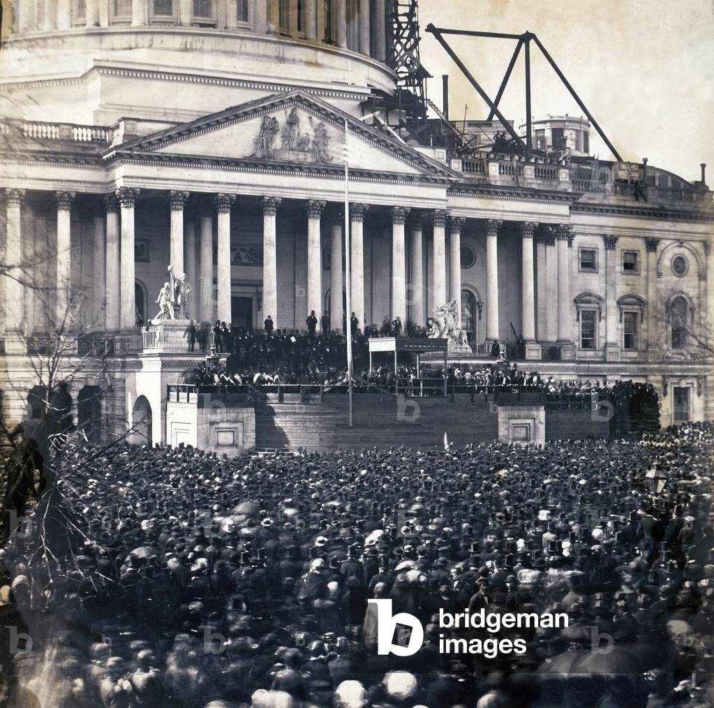 Abraham Lincoln's first inauguration on March 4, 1861 with crowds surrounding U.S. Capitol, which is under construction