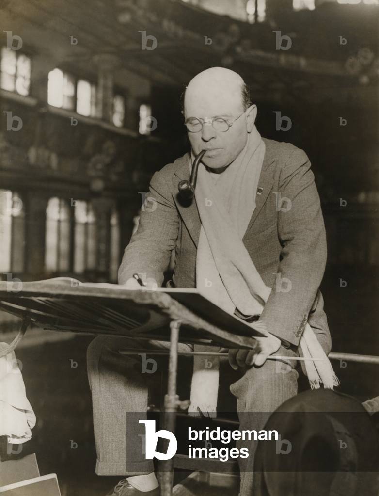 Pablo Casals at rehearsal conducting the Barcelona Philharmonic Orchestra. Casals generally appears at rehearsal in a scarf around his neck and a pipe between his lips. c. 1930-38.