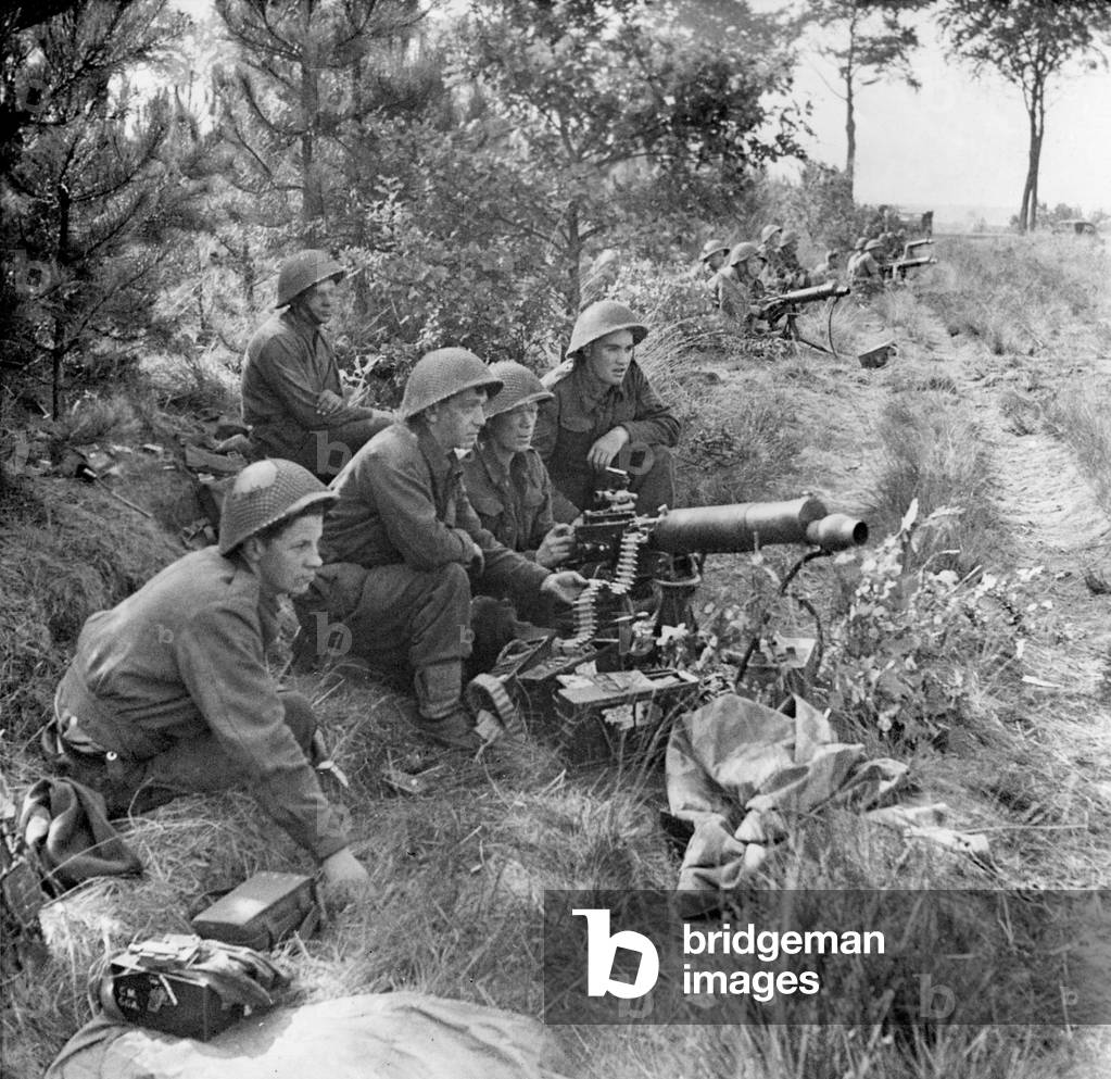 British troops at action stations ready to provide covering fire for the infantry crossing a canal. Sept. 17-25. Operation Market-Garden planned to capture several bridges in Netherlands, but failed with 15,000 Allied casualties. A BRIDGE TO FAR, was a 1977 film based on Cornelius Ryan's 1974 book about the battle. World War 2