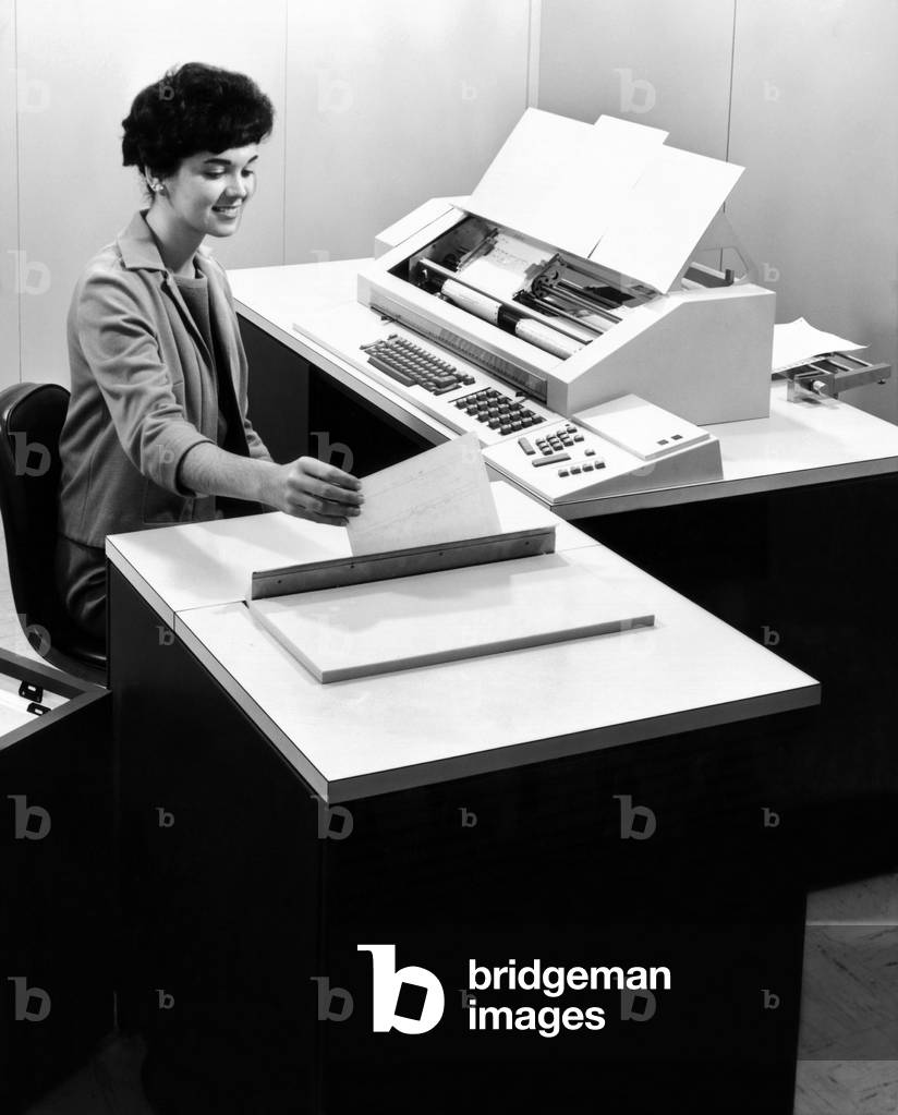 A new IBM computer, the 6400 magnetic ledger accounting machine. It uses ledger cards that have a magnetic stripe that stores the alphabetic and numeric data which appears on the front of the card. When the ledger card is inserted into the magnetic ledger unit the printing unit which will type out customer name, address and other information. May 31, 1963