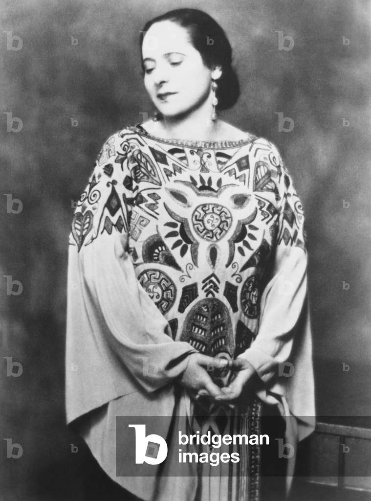 Madame Helena Rubenstein, in a Paul Poiret gown inspired by the Russian ballet. c. 1912. Poiret created modern, loose-fitting designs created for the 'modern' uncorseted figure