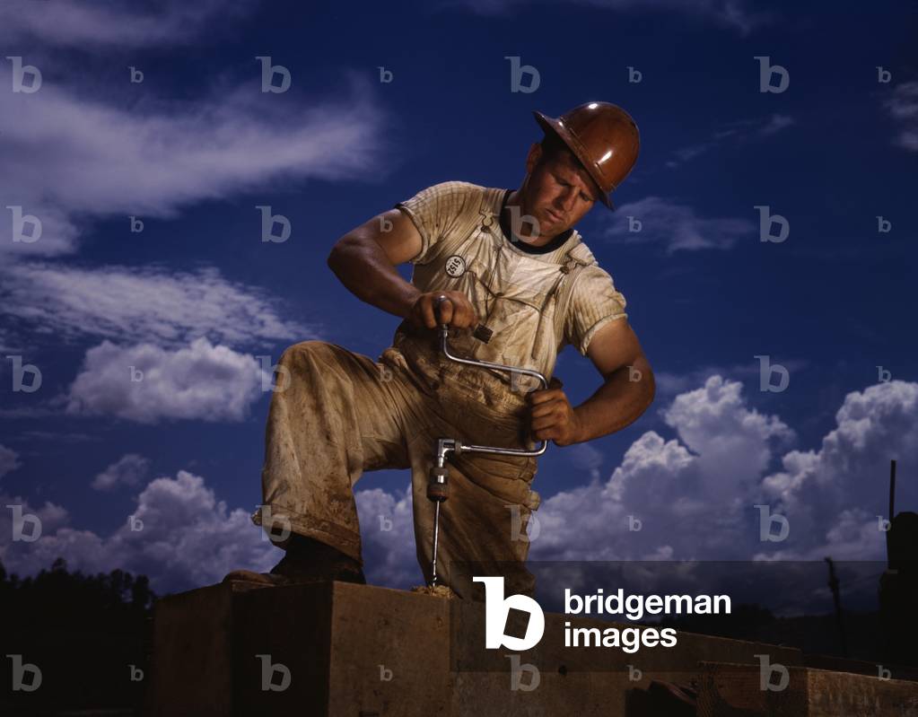 A carpenter working at the Tennessee Valley Authority's Douglas dam on the French Broad River. June 1942