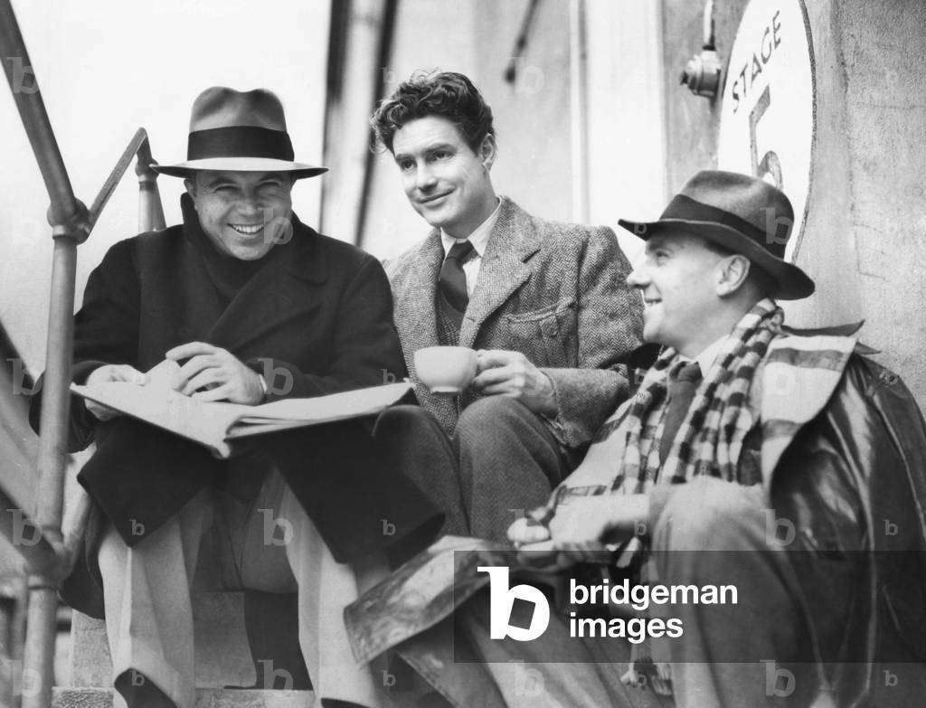 King Vidor, Robert Donat, and Ralph Richardson, during the filming of THE CITADEL, 1938