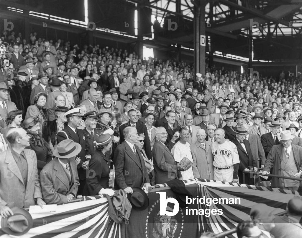 President Harry Truman about to throw the first ball at the 1951 of the season at Griffith Stadium. April 20, 1950. With the President are: Mrs. Alben Barkley, VP Alben Barkley, Bess Truman, Harry Truman, manager Bucky Harris, Clark Griffith, and NY York Yankees manager Casey Stengel.