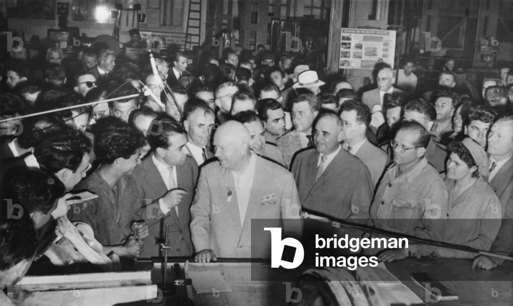 Soviet Premier Nikita Khrushchev (center) with workers in the Grivita Rosie railroad workshop. Bucharest, Romania, July 2, 1962