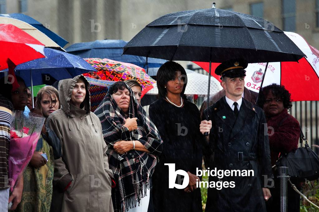 Michelle Obama attends a wreath laying ceremony at the Pentagon on the rainy eighth anniversary of the 9/11 terrorist attacks. Sept. 11 2009.,