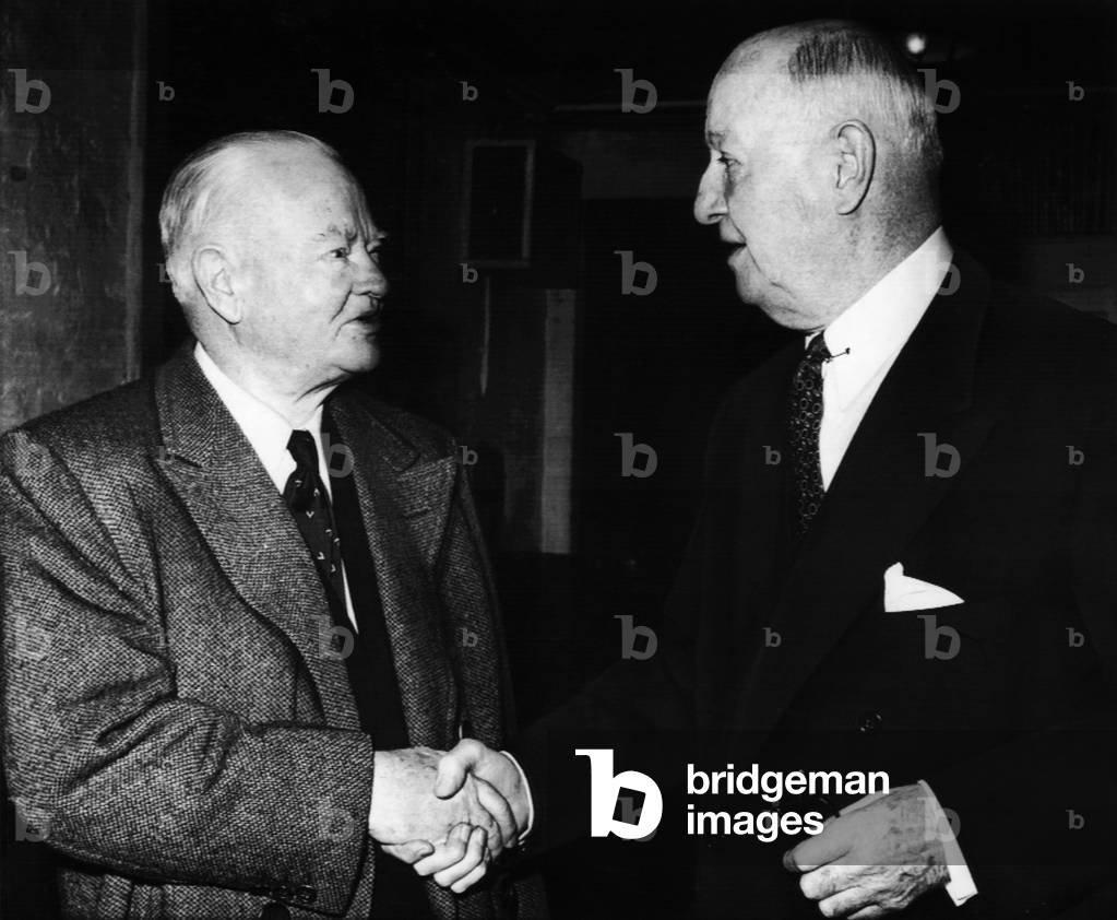 Former President Herbert Hoover, shaking hands with Democratic Party chairman James A. Farley, New York, November 4, 1958
