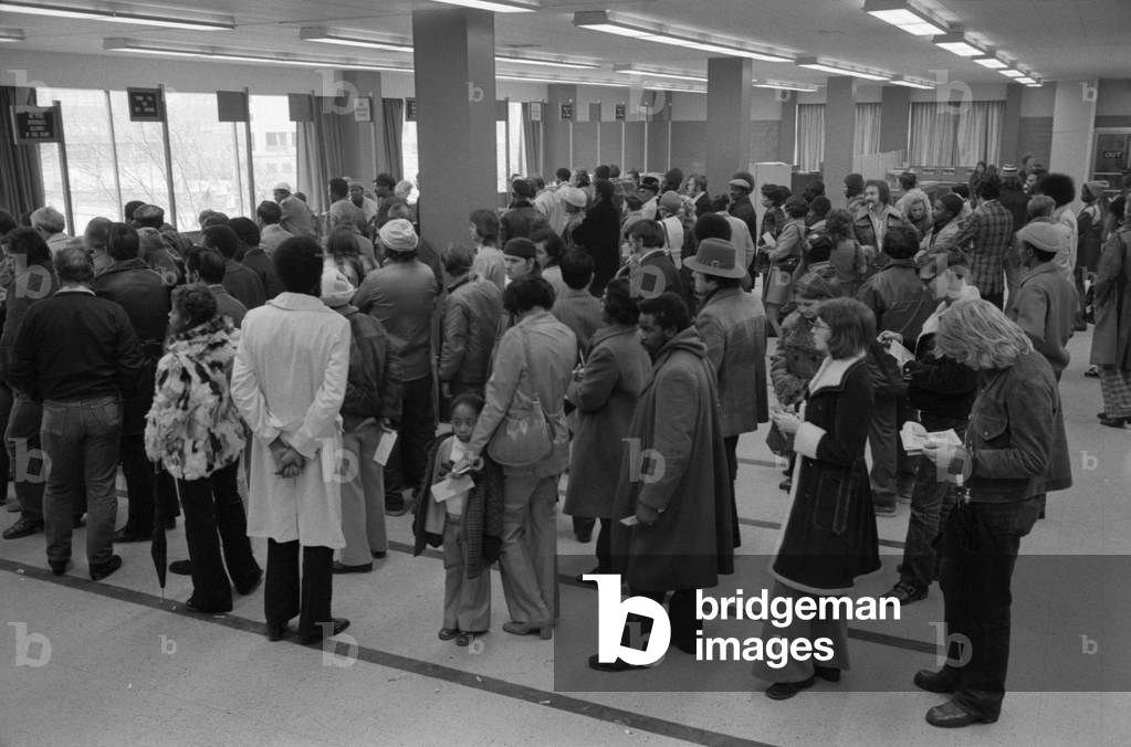 The unemployed and foodstamp applicants wait in long lines at the Baltimore City Welfare Office Maryland. Jan 28 1975