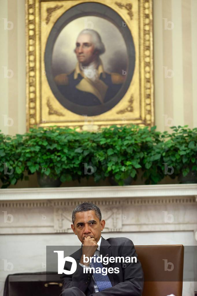 Barack Obama: President Barack Obama is briefed during a meeting with senior advisors in the Oval Office, Aug. 18, 2011.