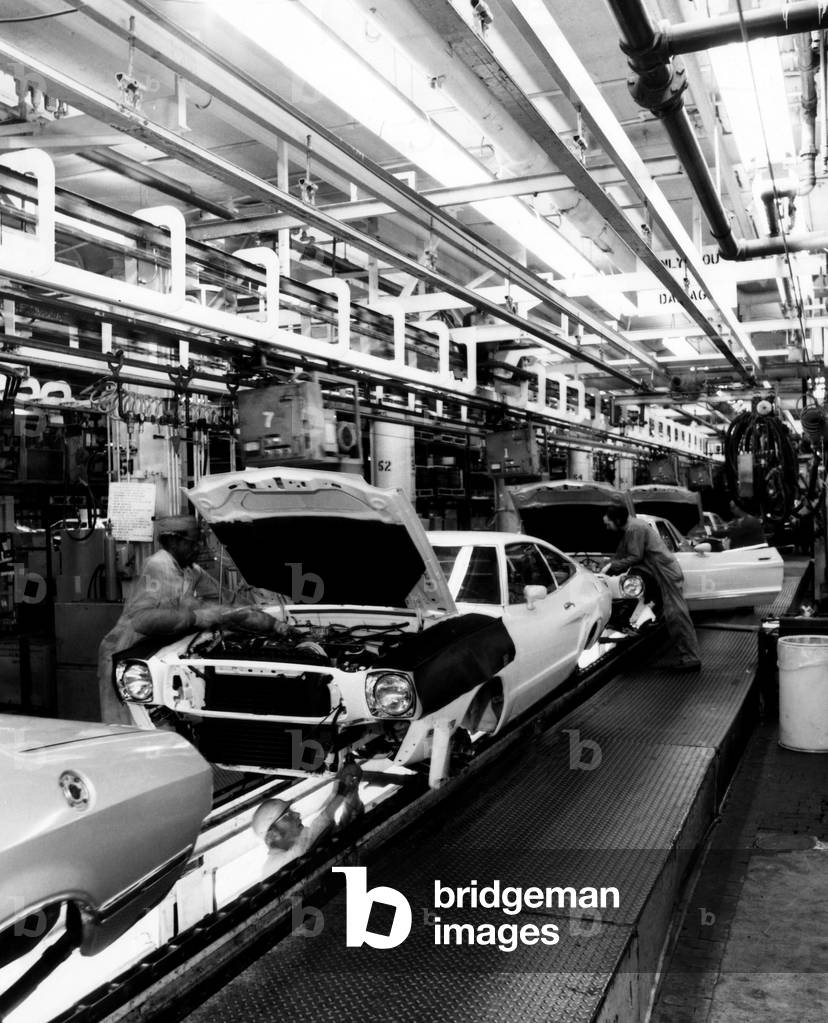Workers assemble Ford Mustangs at the plant in Dearborn, Michigan, 1976