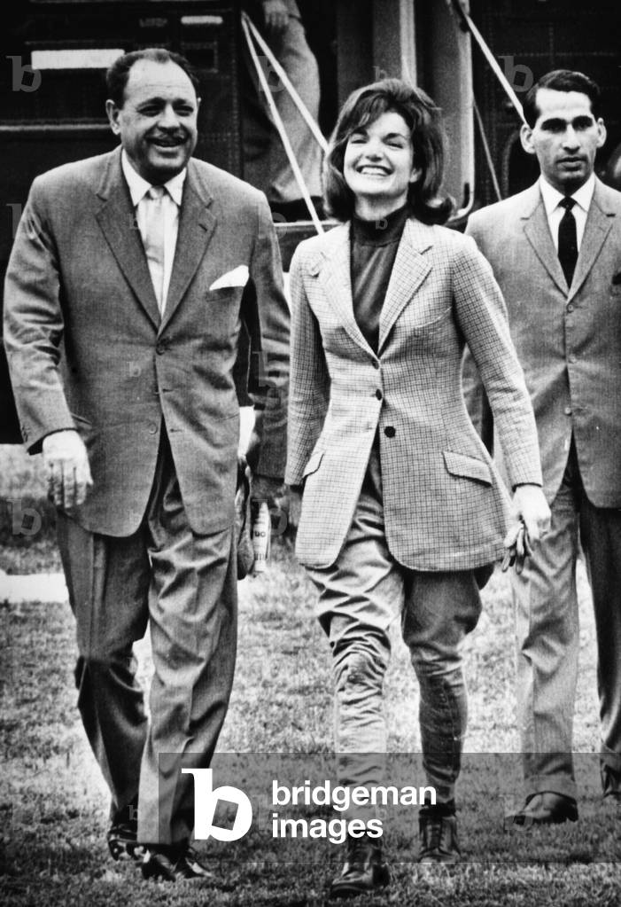President Ayub Khan (left), of Pakistan, and Jacqueline Kennedy (center), returning from horseback riding. September 25, 1962