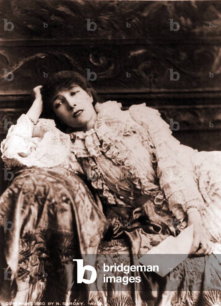 Sarah Bernhardt (1844-1923), French actress, reclining on a divan in an 1880's portrait