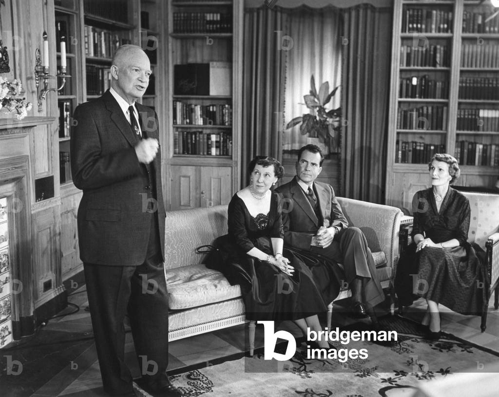 President Eisenhower speaking on election eve, Nov. 5, 1956. Seated are Mamie Eisenhower with Pat and Richard Nixon.