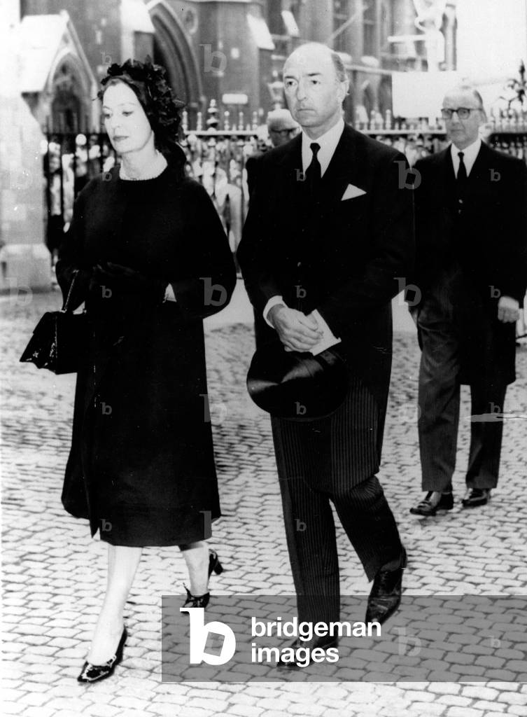 British Minister of War John Profumo and wife Valerie Hobson arrive at Westminster Abbey to attend a memorial service. July 30, 1963
