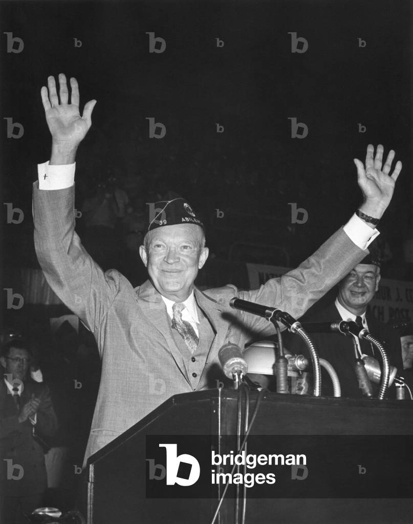 President Eisenhower waving to the Annual Convention of the America Legion. August 29, 1954. National Guard Armory, Washington, D.C.