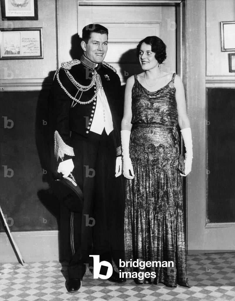 Gene Tunney and wife Polly Lauder Tunney in formal attire. He is wearing a dress uniform of the Marine Corps. Tunney served in the Marine Corps branch of the Connecticut State Militia. The couple married on Oct. 3, 1928, on the condition that Tunney retire from professional boxing.