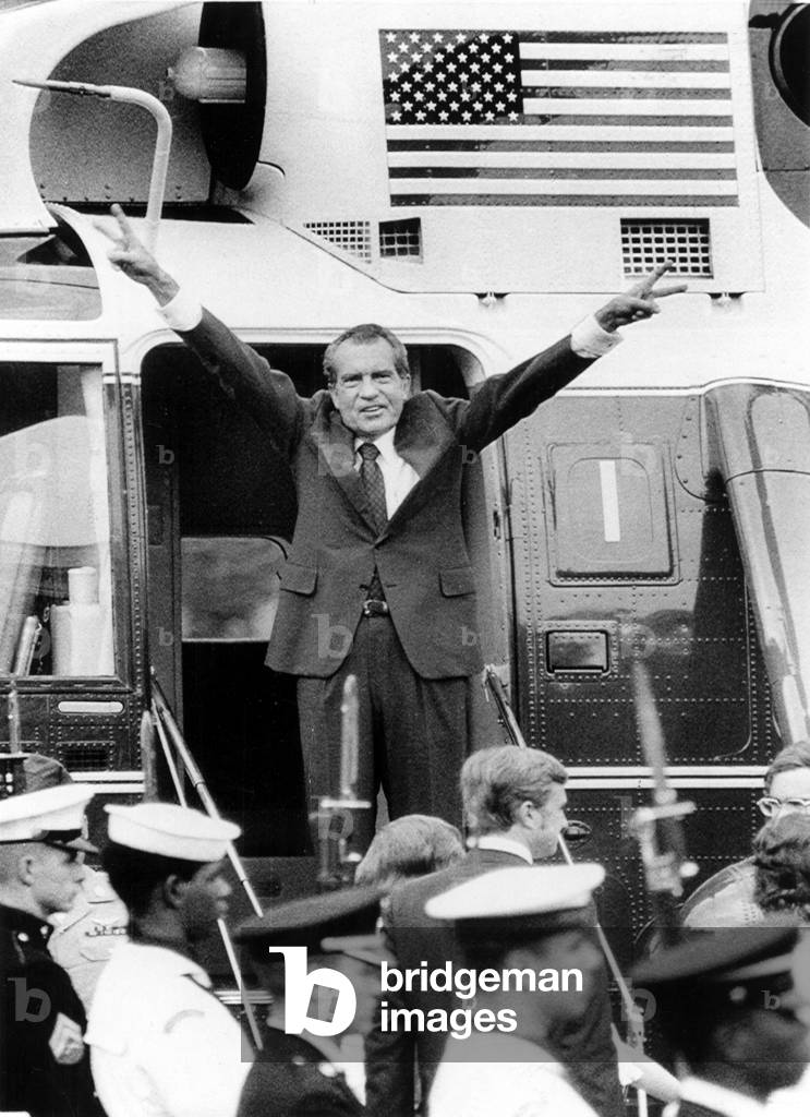 RICHARD NIXON waves with both arms as he bids an emotional farewell to members of his staff after his resignation for the Presidency of the United States. Washington, D.C. 8/8/74.
