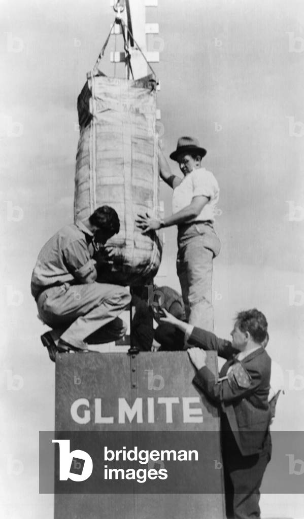 Lester P. Barlow supervising the set up of his 'GLMITE' bomb. He is preparing for a test at Aberdeen Proving Ground, Maryland