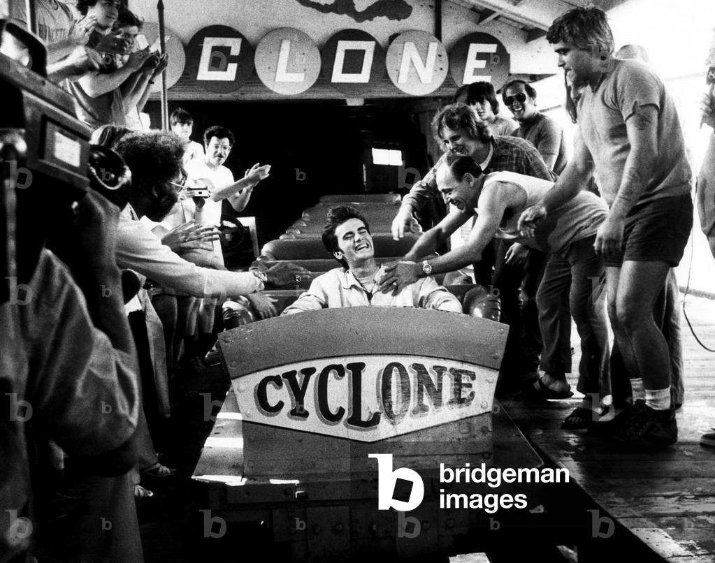 Michael Boodlay is being congratulated by friends and the press after finishing his record-setting 1,000th ride on the Cyclone roller coaster at Coney Island's Astroland Park, August 18, 1975