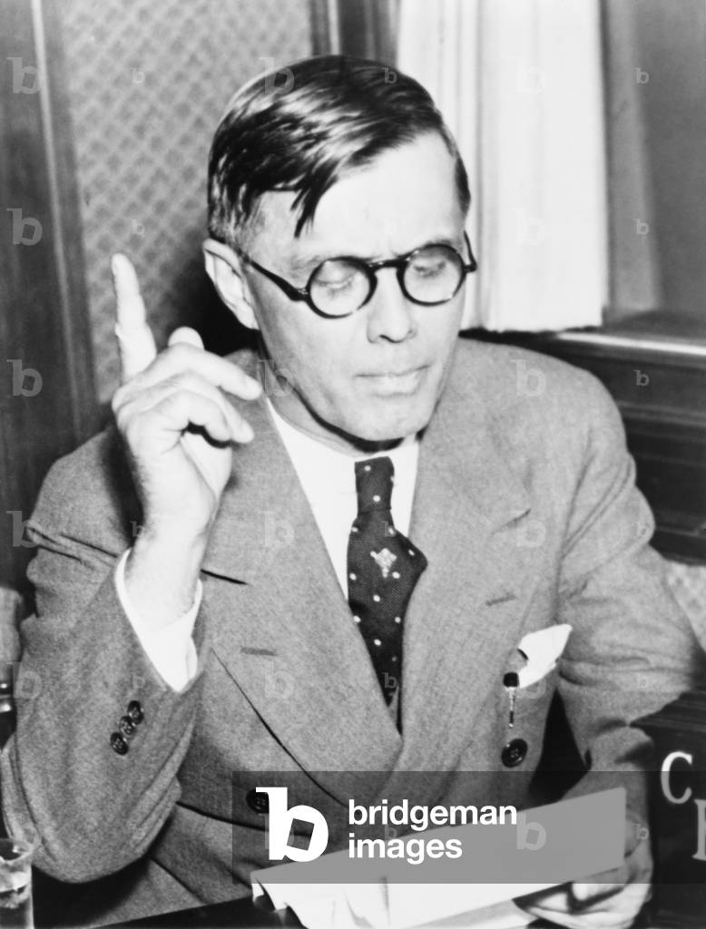 Georgia Governor Eugene Talmadge (1884-1946), assails the New Deal during radio broadcast in 1935. He was a Southern Democratic critic of FDR 's New Deal and an adamant segregationist