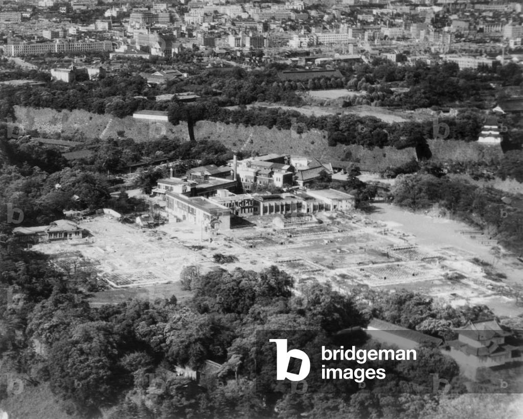 Aerial view of the Imperial Palace in Tokyo, after being bombed by U.S. airplanes. The damaged buildings are outside the walls of the major palace complex. 1945. World War 2