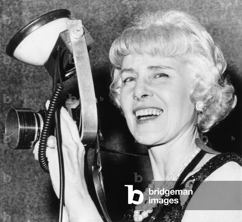 Clare Booth Luce tries out a photographer's camera at a 'Go with Goldwater' dinner. Oct. 9, 1964. She actively campaign for every Republican presidential nominee from Wendell Willkie to Ronald Reagan