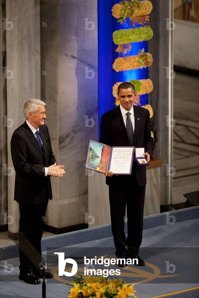 Thorbjorn Jagland presents President Obama with the Nobel Prize medal and diploma during the Nobel Peace Prize ceremony in Oslo City Hall. Dec. 10 2009. (BSWH_2011_8_137)