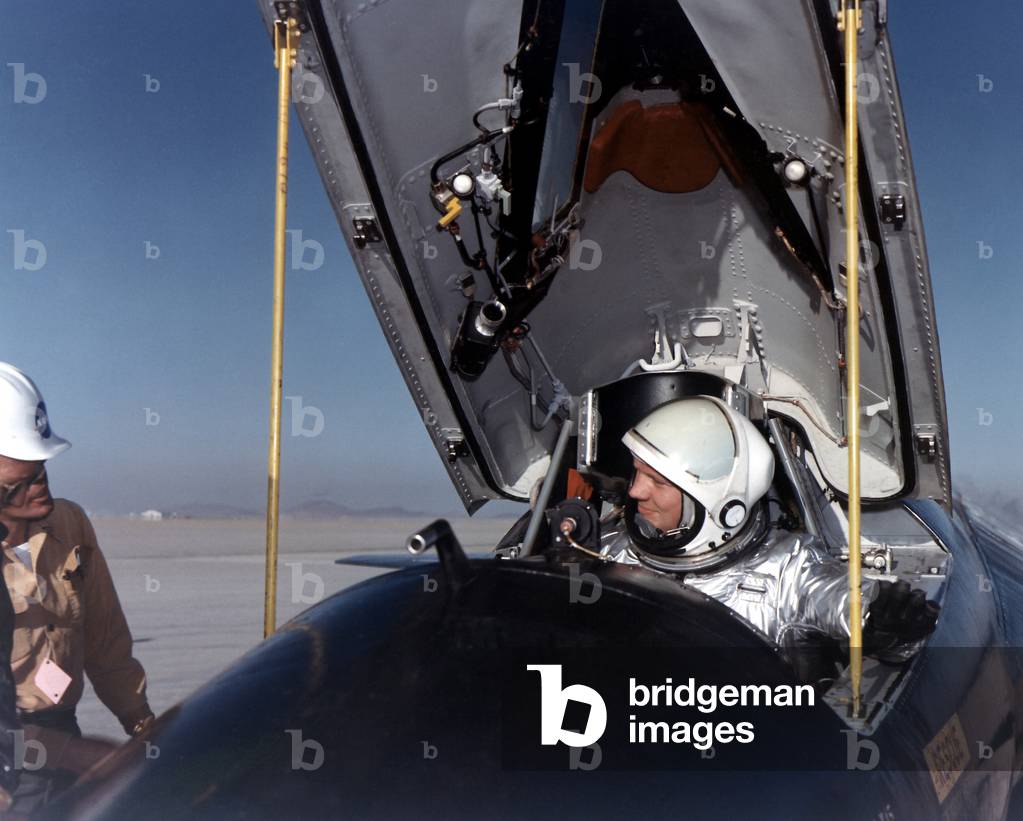 Neil Armstrong in the cockpit of the X-15, which he flew seven times from Dec. 1960 to July 1962. The rocket powered aircraft was flown over a period of nearly 10 years, setting unofficial records for speed 4,520 mph (Mach 6.7), and altitude of 354,200 feet (67 miles)