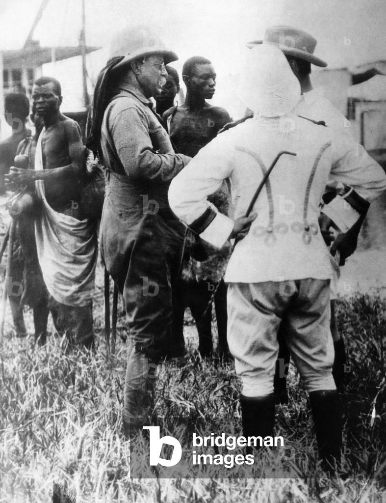 Former U.S. President Theodore Roosevelt (left, wearing pith helmet), on an African hunting trip after his retirement from the White House, March 1909.