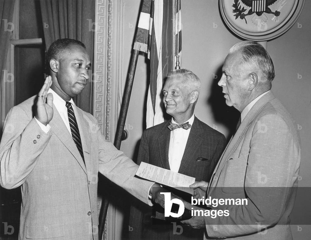 In July of 1955, Frederic Morrow became the first African American Presidential aide in history. He served as Administrative Officer for Special projects on President Eisenhowers staff from 1955 to 1961. The Montgomery Bus Boycott and Little Rock Crisis were the backdrop for Morrows White House years,Chief of Staff Sherman Adams (ctr)