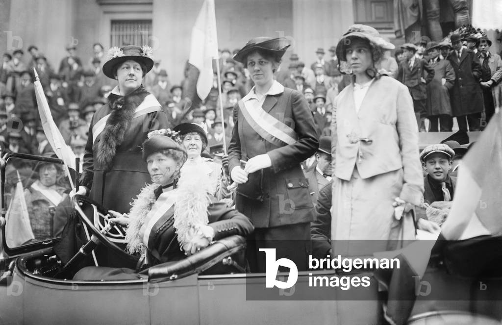 Prominent woman's suffrage advocates parade in an open car supporting the ratification of the 19th amendment granting women the right to vote in federal elections. Left to right: Mrs. W.L. Prendergast, Mrs. W.L. Colt, Doris Stevens, Alice Paul