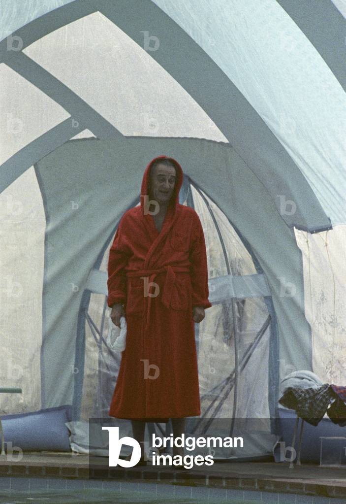 President Johnson taking a winter swim. LBJ in a red terry robe at his winterized swimming pool in Texas. LBJ Ranch, Jan. 5. 1968