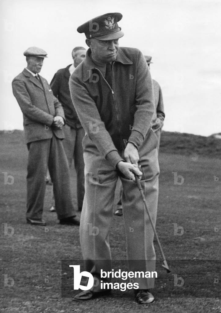 General Dwight Eisenhower, plays golf at St. Andrews Course, Scotland, Oct. 9, 1946. He plays a chip shot at the 16th green