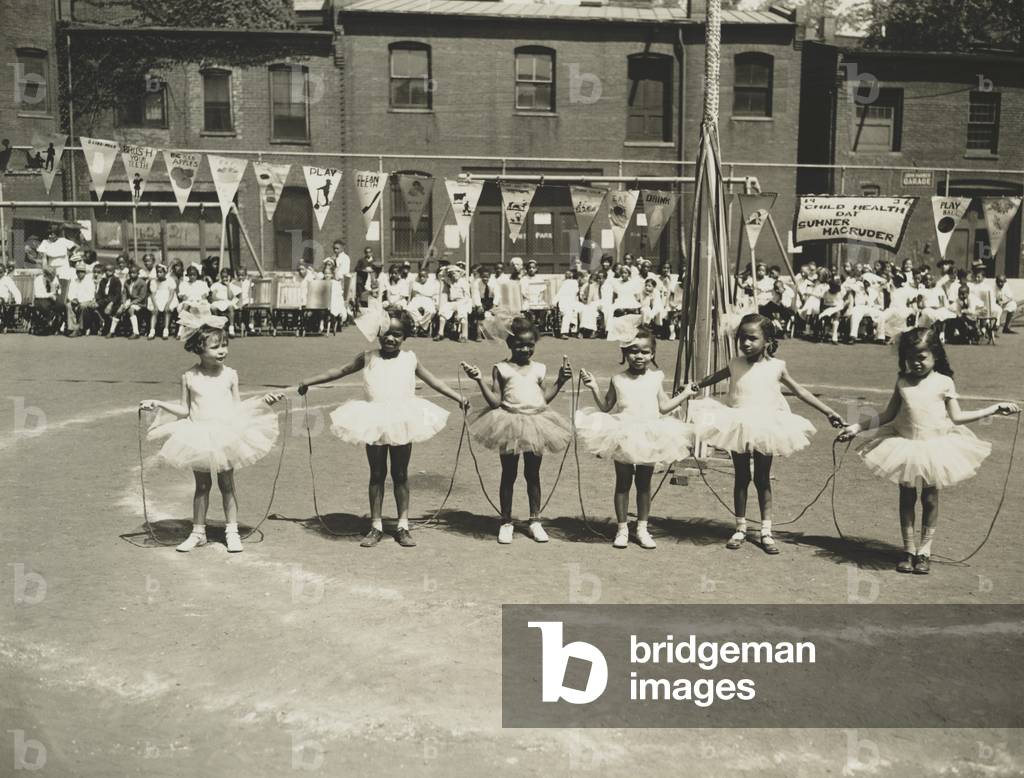 Six little girls wearing tutus during Child Health Day at the Sumner-Magruder elementary school in Washington, D.C. 1936