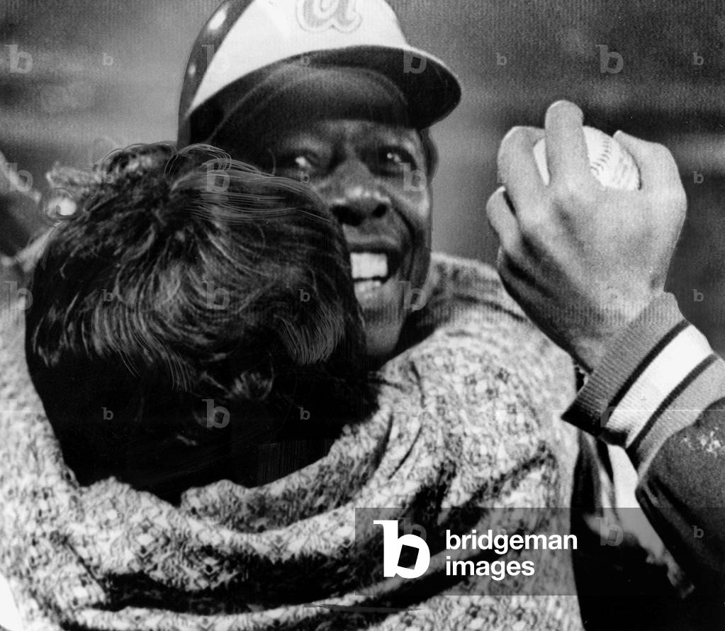 Hank Aaron is hugged by his mother after record breaking 715th home run off of L.A. Dodgers Pitcher Al Downing. Atlanta, GA, 04-08-1974.
