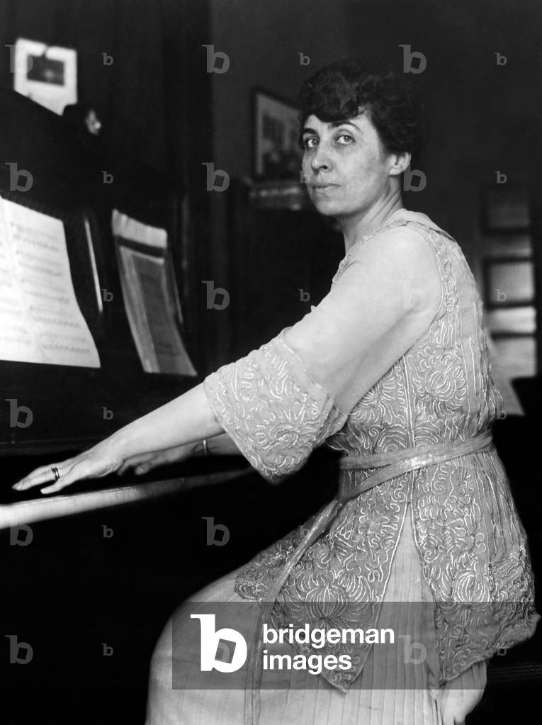 Grace Coolidge, wife of the vice-presidential nominee, plays the piano at her home in Northampton, Massachusetts, 1920