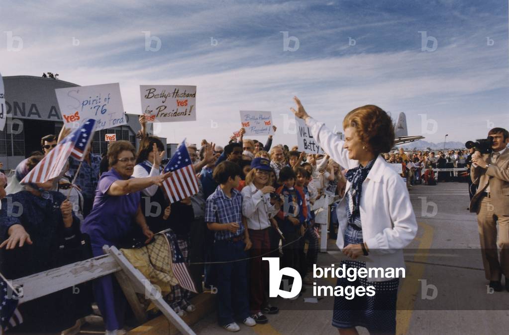 Betty Ford is greeted by a friendly crowd at a Phoenix Arizona campaign stop. Signs read Spirit of 76 Yes Betty Ford Betty's Husband for President We Love Betty. Aug-Oct 1976