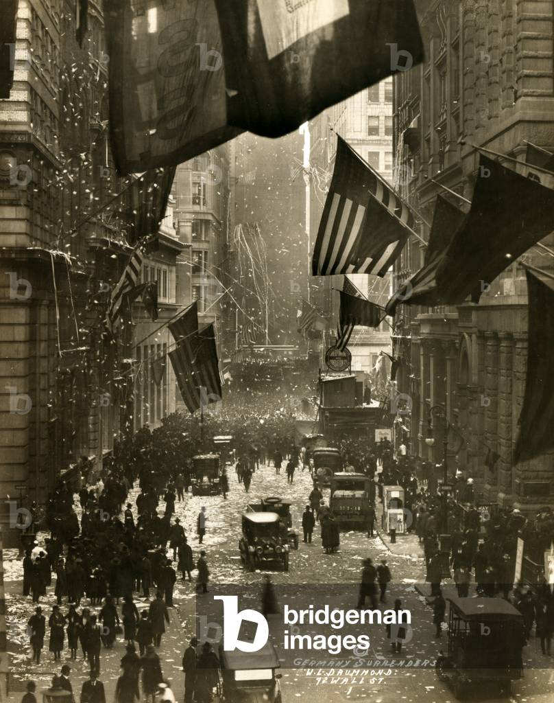Old Glory. Flags wave over Wall Street, New York City in celebration of the surrender of Germany and the end of the Great War. W.L. Drummond, photographer, Dec 5, 1918